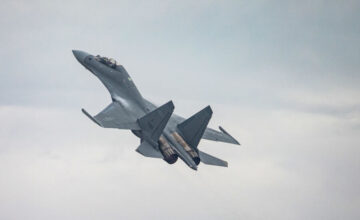 China demonstrates power in disputed waters with Russian fighter jets